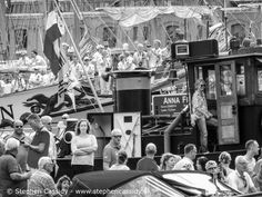 an old black and white photo of people on a boat