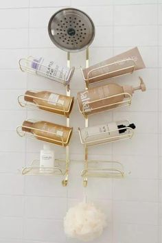 a shower caddy filled with lots of different types of hair care products hanging from it's sides