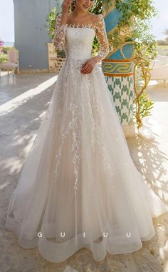 a woman in a wedding dress posing for the camera