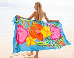 Embrace the essence of tropical beauty with our SHU-SHI Hibiscus Floral Sarong. Each sarong is a canvas of creativity, adorned with hand-painted hibiscus flowers, symbolizing delicate beauty and strong connections. This versatile piece is your go-to for beach days, and poolside relaxation, and adds a touch of island charm to any outfit. Features: Unique Artistry: Revel in the uniqueness of hand-painted designs, where traditional motifs meet the timeless charm of the hibiscus. Versatile Wear: Mor Long Pool, Bathing Suit Women, Kimono Shrug, Tropical Beauty, Women Flower, Painted Designs, Beach Wrap, Traditional Motifs, Poncho Tops