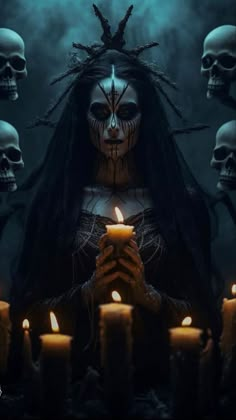 a woman holding a lit candle in front of skulls with long hair and makeup on her face