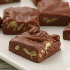 several pieces of chocolate on a white plate