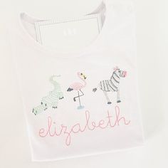 Welcome to Cypress Stitch. To find out about the latest specials, discounts, and promotions. Please go to our website at www.CypressStitch.com or www.Facebook.com/ShopCypressStitch. For all the trips to the zoo throughout the year, this shirt is perfect. This is great for everyday wear and wearing around the school yard. Animals, font style, stitch color, and are completely customizable. If you are unsure of which font color or font style, reach out to us and we can help. Personalization Please Yard Animals, Zoo Trip, Personalized Clothing, Monogram Shirts, School Yard, Zoo Animal, Baby Gown, The Zoo, Travel Shirts