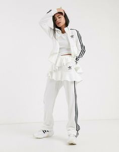 Regular fit is not tight and not loose, the perfect in-between fit Open hems 79% cotton / 21% recycled polyester velour Side zip pocket; Elastic waist Double-layer satin frill Cute Workout Outfits, Ruffle Pants, Jogging Suit, Track Pant, Pants White, Active Wear Pants, Adidas X, White Skirt, Adidas Pants