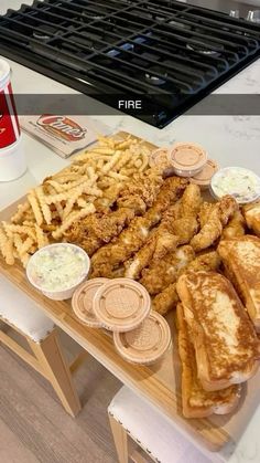 a table topped with lots of food next to a cup of coffee