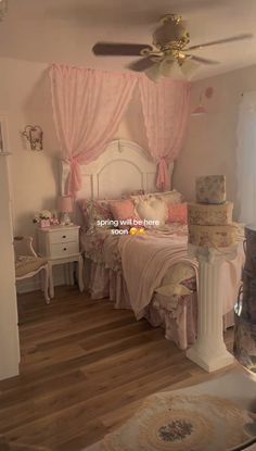 a bed room with a neatly made bed next to a dresser and a ceiling fan