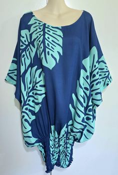 Tunic top/dress.  Turquoise on blue, BABY MONSTERA print.  Perfect island wear--Cool and comfortable, dress up or dress down, for an evening out, office attire, or a day at the beach.  Hand made in Hawaii.  Light weight 100% rayon.  One size fits most,  suggest Medium to 2x Mannequin in the photo is a size x-small.  Model is a size Small-Medium.  Hand wash and hang to dry Monstera Print, Aloha Wear, Island Wear, Hawaiian Outfit, Office Attire, Blue Baby, Clothing Labels, Comfortable Dress, Womens Tunics