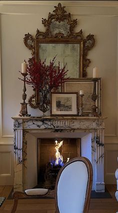 a living room filled with furniture and a fire place under a mirror on the wall