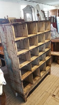 an old wooden bookcase with lots of shelves