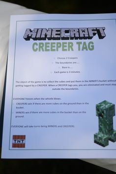 the minecraft creeper tag is displayed in front of a sign that reads,'creeper tag '