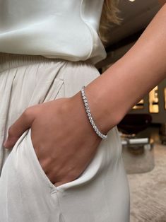 This tennis bracelet is prong set with 54 round brilliant cut diamonds, weighing approximately 0.15 carats each. Classic Bracelets, Diamond Tennis Bracelet, Gold Bracelet For Women, Gold Bracelets, Classy Jewelry, Jewelry Lookbook, Tennis Bracelet Diamond, Bracelets For Women, Girly Jewelry