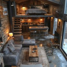 a living room filled with furniture and a fire place next to a loft style bed