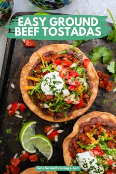 easy ground beef tostadas on a tray with limes and cilantro