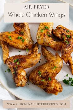 air fryer whole chicken wings on a white plate