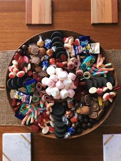 a bowl filled with assorted candy and candies