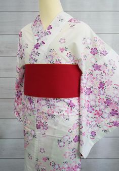 This beautiful women's yukata features a delicate floral pattern in soft pink and purple tones. Perfect for summer festivals, casual outings, or special occasions. Made from lightweight, breathable fabric, it ensures comfort while keeping you stylish.  Please watch youtube video on how to wear Kimono Yukata and how to tie obi belt. https://youtu.be/r2MmMcfZpsY *CONDITION New *Size One size Length: 64.1" / 163cm Center to sleeve: 26.3" / 67cm Around hip: 57.4" / 146cm *CARE Machine wash cold Gentle cycle Hand dry in the shade Do not use bleach *Note Obi Belt is sold separately. Color may vary depending on the type of lighting and/or with different monitor settings. How To Wear Kimono, Kimono Women, Yukata Kimono, Kimono Yukata, Watch Youtube, Summer Festivals, Summer Kimono, Purple Tones, Obi Belt