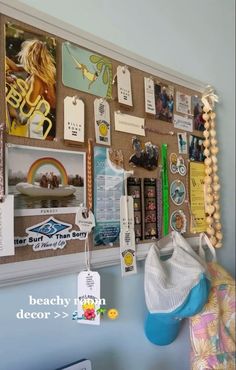 a bulletin board covered in pictures and magnets next to a wall hanging on the wall