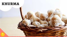 a basket filled with sugar covered donuts on top of a table