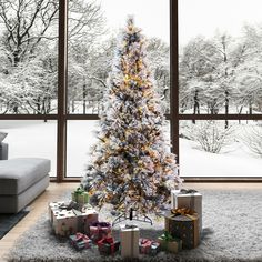 a decorated christmas tree in front of a window with presents under it and snow on the ground