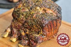 a large piece of meat sitting on top of a wooden cutting board