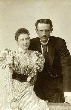 an old black and white photo of a man and woman