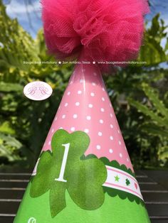 ☆FREE☆ economy shipping to USA on orders over $35! ► Shop today! Let's celebrate your Lucky Charm! This super cute party hat comes your honoree's name and age for an adorable pink lucky charm party. Your beautiful paper* hat is hand made to order with professional matte paper, printed with premium Canon ink. Each lovely party hat is then laminated for rigidity and longevity. This hand made pink tulle pom-pom and soft green tying ribbon are the perfect finishing touches on this adorable custom pa Novelty Pink Mini Hat For Birthday, Pink Novelty Mini Hat For Birthday, Cute Pink Party Supplies For Birthday Gift, Playful Pink Mini Hats For Birthday, Playful Pink Mini Hats For Birthdays, Whimsical Pink Birthday Party Supplies, Lucky Charm Party, Lucky Charm Birthday, Tying Ribbon