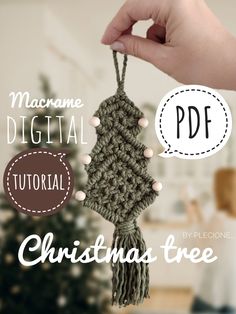 a hand holding a crocheted christmas tree ornament with the text machine digital