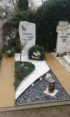 a couple of tombstones sitting on top of a sidewalk