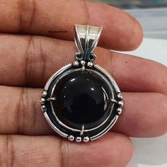 Artisan Black Onyx Necklace, Handmade Oval Onyx Jewelry, Black Artisan Round Necklace, Artisan Black Round Necklace, Polished Onyx Round Pendant Jewelry, Black Round Pendant Jewelry, Black Jewelry With Large Round Pendant, Artisan Black Pendant Jewelry, Round Obsidian Jewelry For Gift