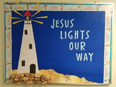 a bulletin board with the words jesus lights our way and a lighthouse made out of wine corks