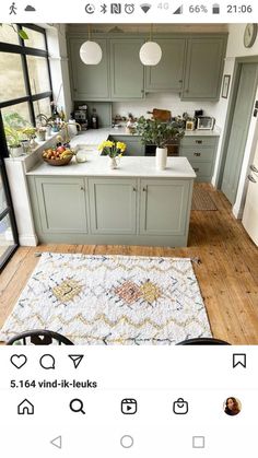 the instagram page shows an image of a kitchen with gray cabinets and white counter tops