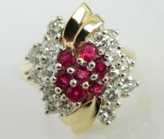 Here is a wonderful 14K gold diamond and ruby ring. This ring has incredible shine and eye appeal. The combination of the gold along with the stones really make this ring stand out. This is the perfect ring for someone who wants a timeless, vintage piece. Ring: 14K Gold Stones: 1.60 carats of Diamonds, Rubies Size: 8 Marked: 14K Weight: 9.4 grams SKU#20CB81917 If you have any questions on this item, please message us! GandDJewelers.etsy.com For ring sizing, please contact us for information. Ple Red Cluster Diamond Ring In 14k Gold, Red Diamond Cluster Ring In 14k Gold, Cluster Ruby Ring With Diamond Accents, Red Diamond Cluster Ring With Vvs Clarity, Dazzling Ruby Ring With Diamond Accents For Anniversary, Multi-stone Ruby Cluster Diamond Ring, Classic Red Multi-stone Cluster Ring, Red Cluster Ring With Diamond Accents, Red Cluster Ring With Diamond Accents For Anniversary