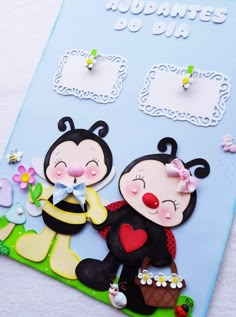 a close up of a greeting card with two cartoon characters on the front and back