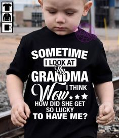 a young boy wearing a black shirt with the words back off i have a crazy grandma