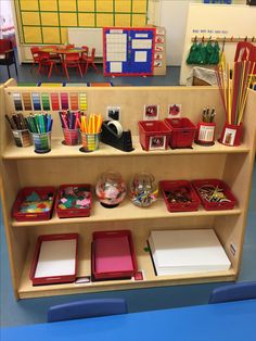 the shelves are filled with school supplies and stationery for children to write or draw