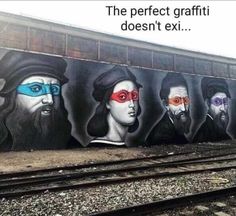 some graffiti on the side of a wall with three men wearing blindfolds and one has red eye glasses