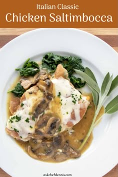 a white plate topped with meat covered in gravy and mushrooms next to green leaves