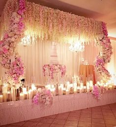 a table with candles and flowers on it