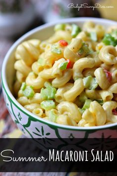 a bowl filled with macaroni salad on top of a table