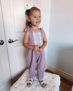 This charming jumpsuit in dusty lavender is the perfect outfit for your infant or toddler, complete with sweet lace details and tie straps. FIT: This Item is running true to size FABRIC & CARE: 95% polyester, 5% spandex* Imported Machine Wash Cold Lay Flat To Dry *all items sold separately Sleeveless Purple Bubble Romper For Spring, Spring Purple Sleeveless Bubble Romper, Spring Sleeveless Purple Bubble Romper, Cute Purple Bubble Romper For Spring, Summer Picture Outfits, Dusty Lavender, Toddler Summer, Picture Outfits, Girls Rompers