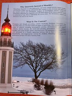 an open book with a lighthouse in the background