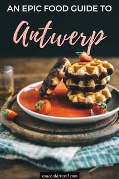 a plate with waffles and strawberries on it that says an epic food guide to antwerp