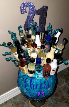 a vase filled with lots of liquor bottles