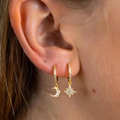 🌙 Moon and Star Pave Huggie Earrings  🌟 Embrace the beauty of the night sky with our enchanting Moon and Star Pave Huggie Earrings. Crafted from high-quality 925 sterling silver and plated in radiant gold, these dainty huggie hoops feature sparkling pave-set cubic zirconia diamonds. The delicate moon and star charms dangle elegantly, adding a celestial sparkle to your look. Perfect for everyday wear or as a meaningful gift, these earrings are a stunning symbol of love, dreams, and magic. 🌟 Ke Celestial Moon Earrings With Star Charm, Celestial Moon Shaped Earrings With Star Charm, Celestial Moon-shaped Earrings With Star Charm, Celestial Hoop Earrings With Star Charm, Celestial Star-shaped Hoop Earrings, Celestial Star-shaped Hoop Earrings With Moon Charm, Star Earring, Huggie Earrings Gold, Earrings Moon