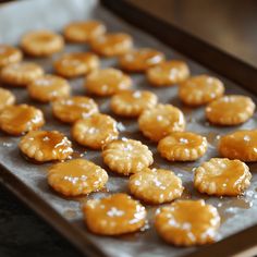 there are many small cookies that have been baked on the baking sheet, ready to be eaten