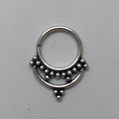 "These are so pretty and light. Made is 925 sterling silver with tribal details. The rings are all 10mm (1cm or .40\") in diameter. The wire is 18 gauge. They are only finished on one side since each one is made BY HAND so there may be very slight differences. One of the images contains numbers to specify which you would like from the drop down menu." Adjustable Nickel Free Silver Body Jewelry, Adjustable Nickel-free Silver Body Jewelry, Silver Internally Threaded Hoop Body Jewelry, Adjustable Minimalist Silver Belly Rings, Minimalist Adjustable Silver Belly Rings, Silver Internally Threaded Small Hoop Belly Ring, Silver Stackable Hoop Cartilage Earrings, Nickel-free Small Hoop Silver Belly Rings, Nickel Free Silver Piercings