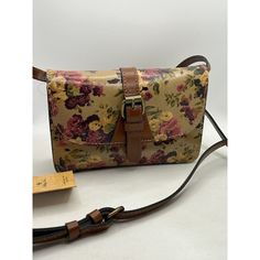 This Patricia Nash Torri Crossbody Bag Is A Must-Have For Any Fashion-Forward Woman. The Small Size And Adjustable Strap Make It Perfect For Everyday Use, While The Antique Rose Floral Pattern And Logo Accents Add A Touch Of Sophistication. The Exterior Is Made Of High-Quality Leather With Antique Brass Hardware, And The Interior Lining Is Faux Suede With A Gold Color. The Bag Features A Flap With Snap Closure, And The Dimensions Are 7.5" Width, 5.5" Height, And 2" Depth. It Was Crafted In Italy Leather Floral Print Satchel Shoulder Bag, Floral Print Leather Shoulder Bag, Floral Print Crossbody Shoulder Bag For Everyday Use, Everyday Floral Print Crossbody Shoulder Bag, Leather Travel Bag With Floral Print, Leather Shoulder Bag With Floral Print For Travel, Travel Floral Print Leather Shoulder Bag, Leather Floral Print Shoulder Bag For Travel, Floral Print Satchel For Everyday Use