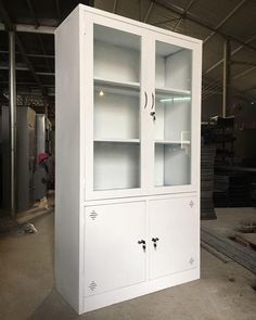 a large white cabinet sitting inside of a warehouse