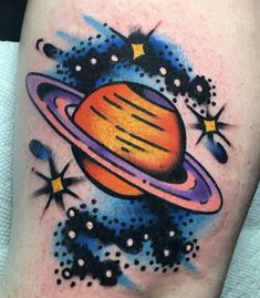 a tattoo with an image of saturn on it