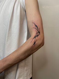 a man with a tattoo on his arm